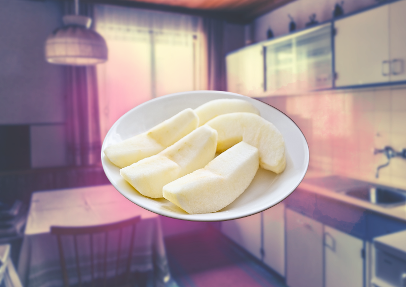 A plate of cut and peeled apples sits on a white plate, imposed on a background of a small blue/grey tone kitchen with sink/counter/cabinet/lamp and dining table.  Pink wisps of smoke surround the plate of apples.  