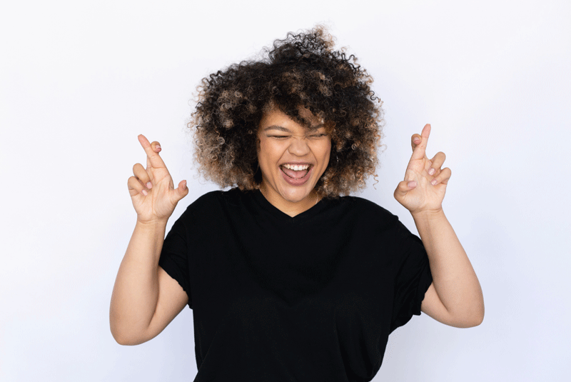A person with an afro crosses their fingers and smiles.  This could represent the excitement of starting a fulfilling life.  Learn more about how you can find self fulfillment in Ontario, CA by searching for an Ontario therapist. They can assist you in creating a self fulfillment in Ontario, CA via online therapy in Ontario and other services.
